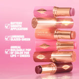 Unreal Lip + Cheek Glow Blush Stick with Hyaluronic Acid - Rosy Glow (warm rosy pink)
